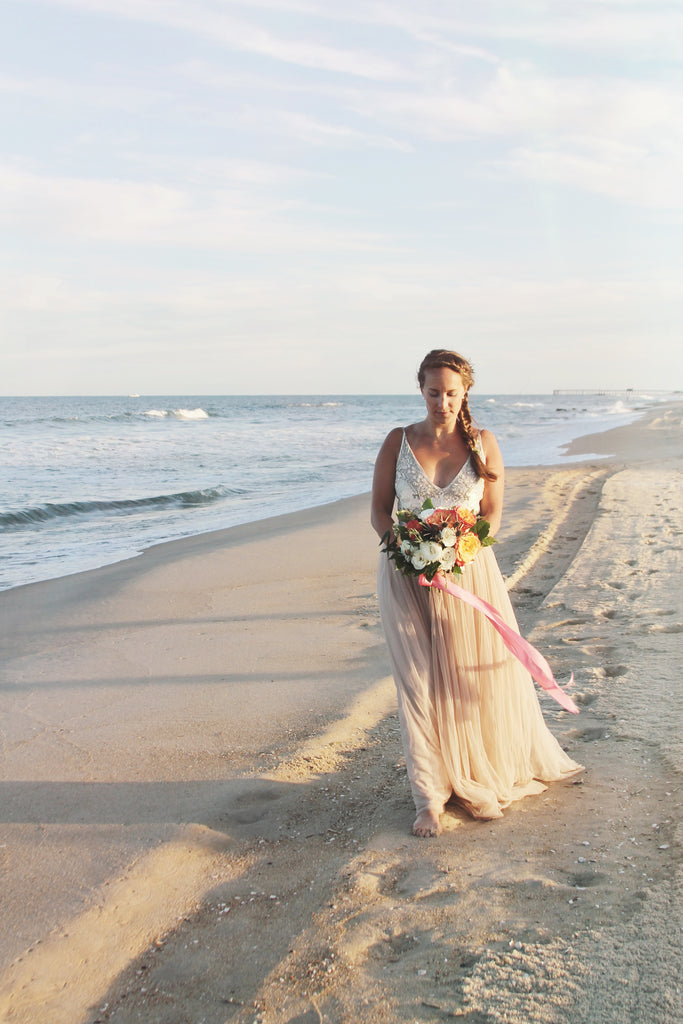 Blush, Coral & White Beach Wedding Inspiration with Greenery & A Circle Archway